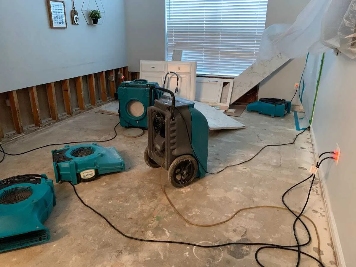 Dehumidifier in flood-cut room for Water Damage Restoration in Dacula